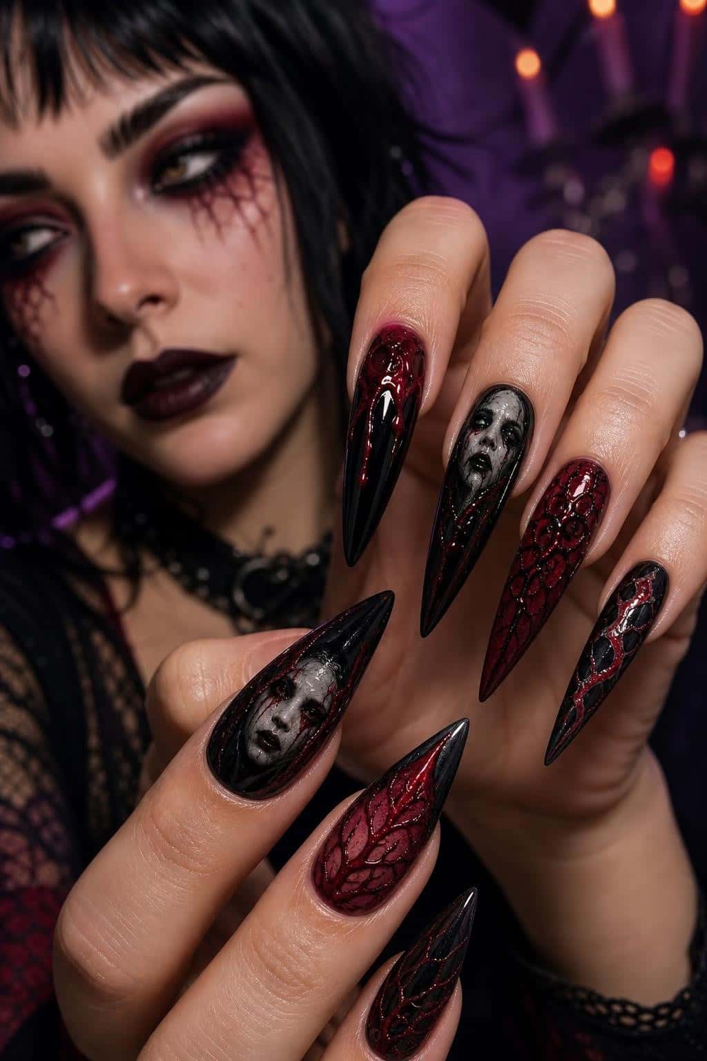 Long stiletto nails with gothic hand-painted art and textured patterns in deep red and black.