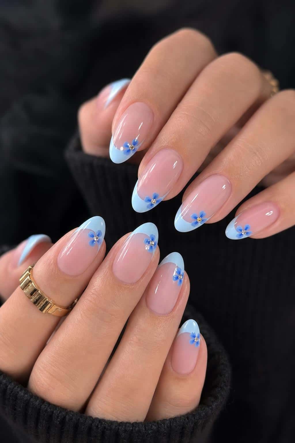 Long blue glitter stiletto nails with holographic shimmer and ombre tips.