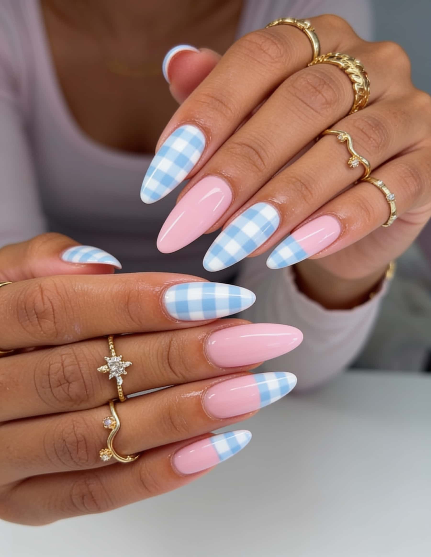 Almond-shaped nails with a pastel floral plaid pattern and glossy finish.