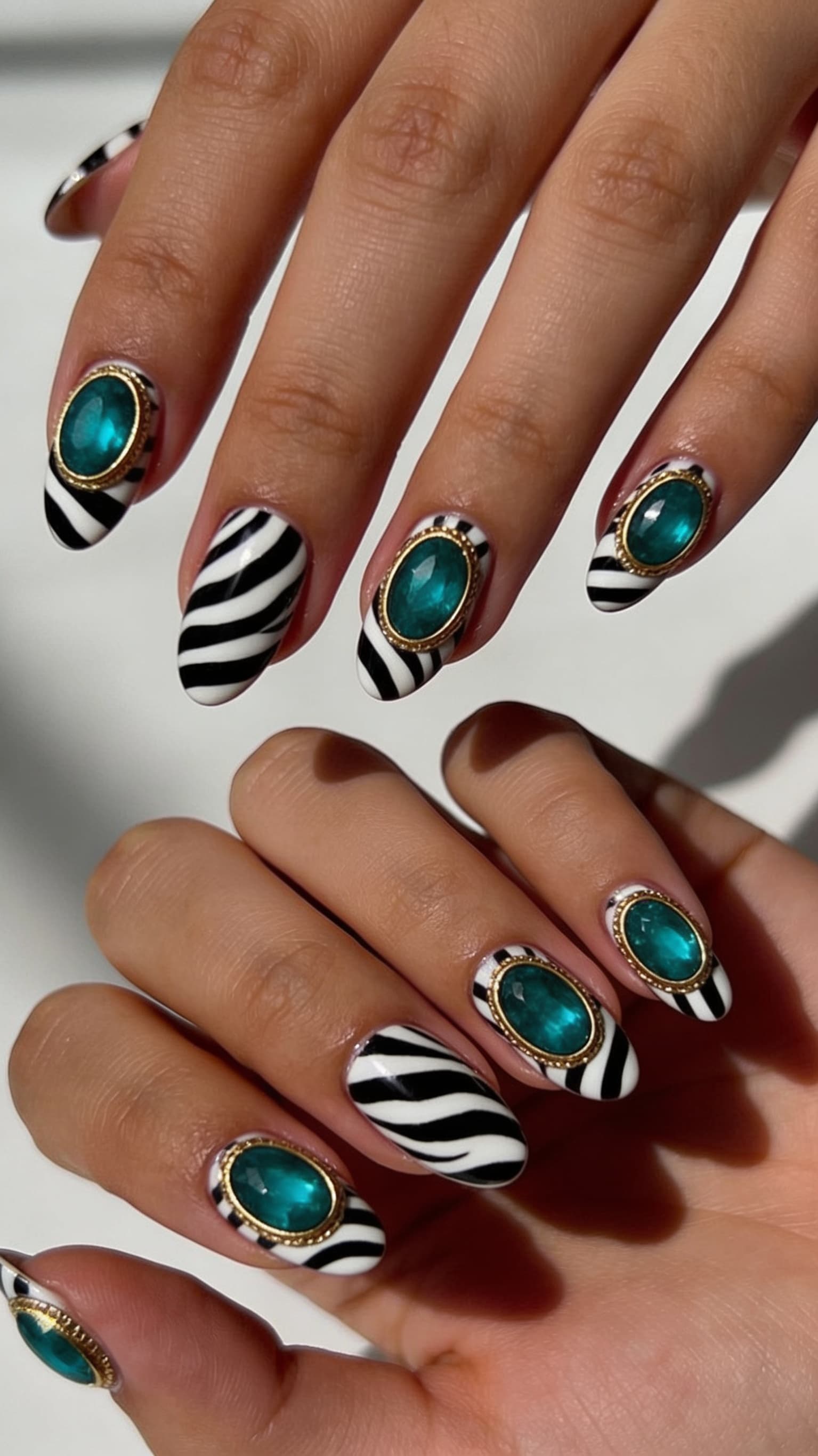 Zebra Emerald Jewels nail inspo with animal print and green crystal accents