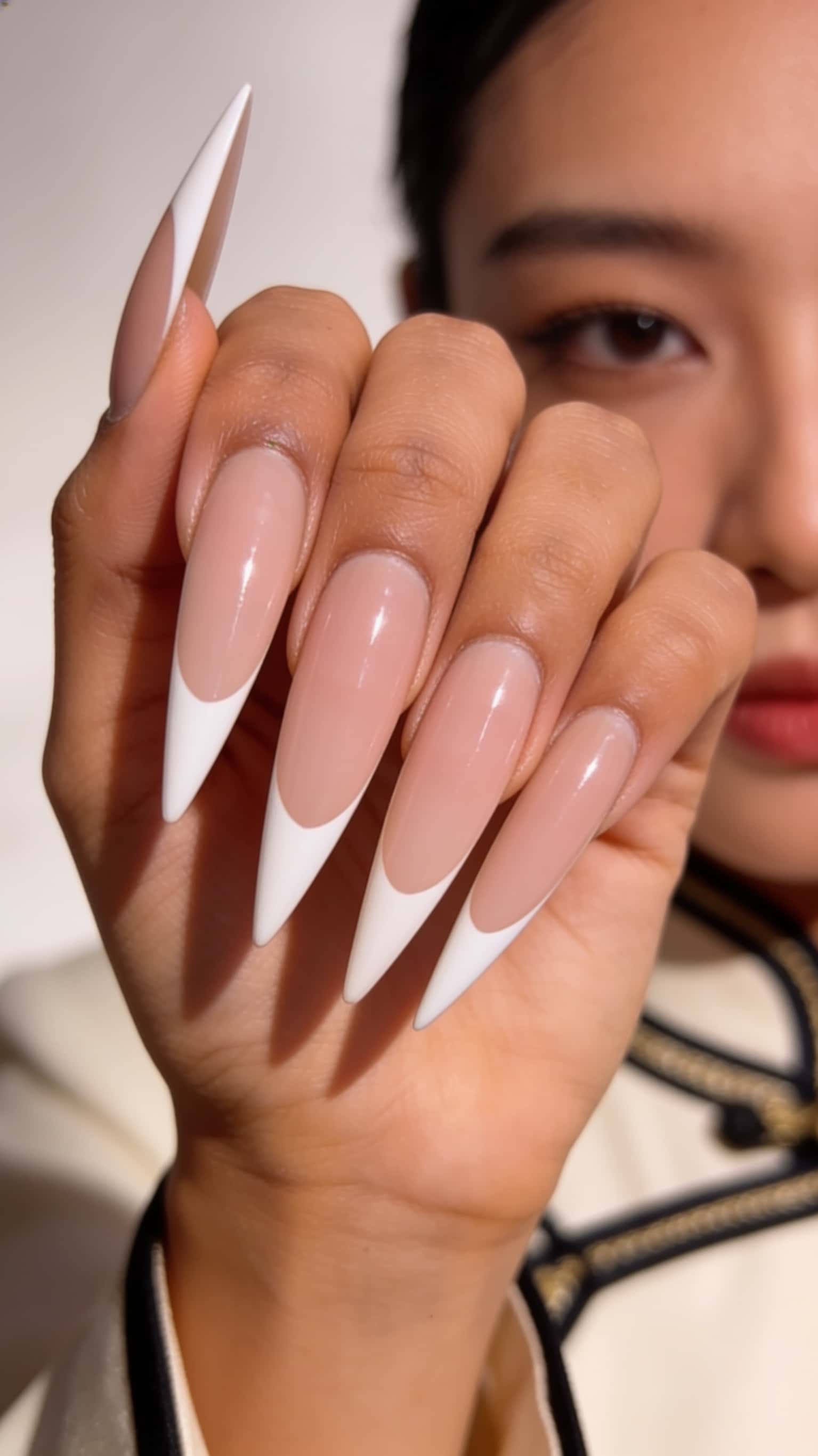 6 vacation nail ideas on manicured hands, including paris, france, bahamas, brazil, thailand.