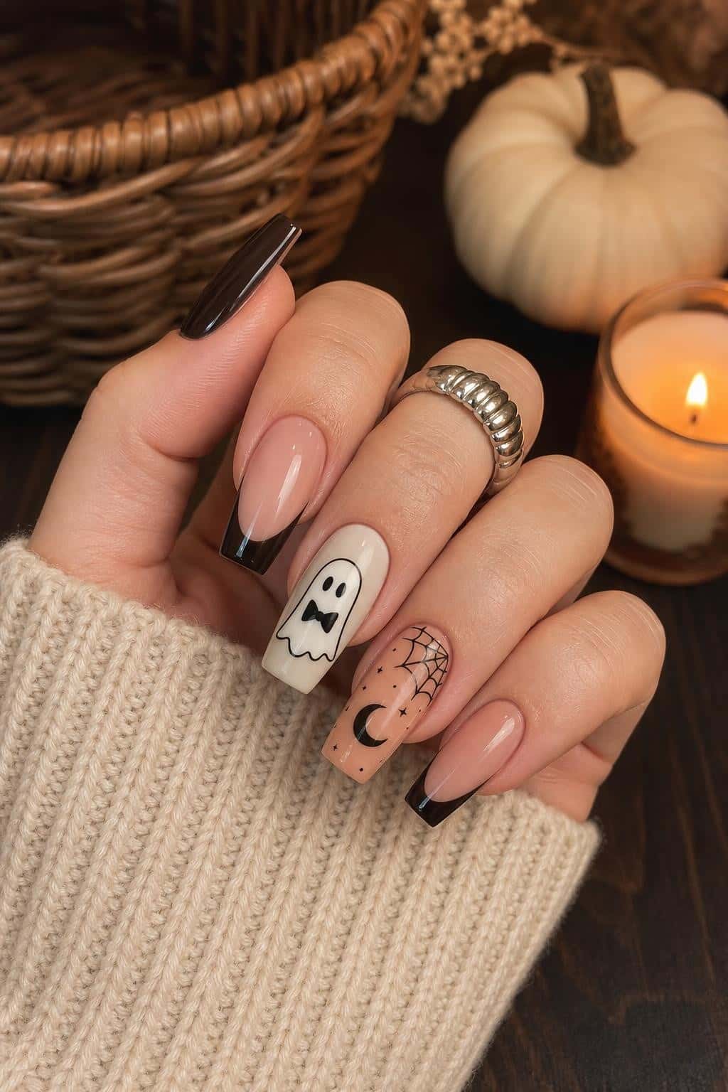 4 halloween nail ideas on manicured hands, tagged summerweennails, halloween nails, nail inspo.