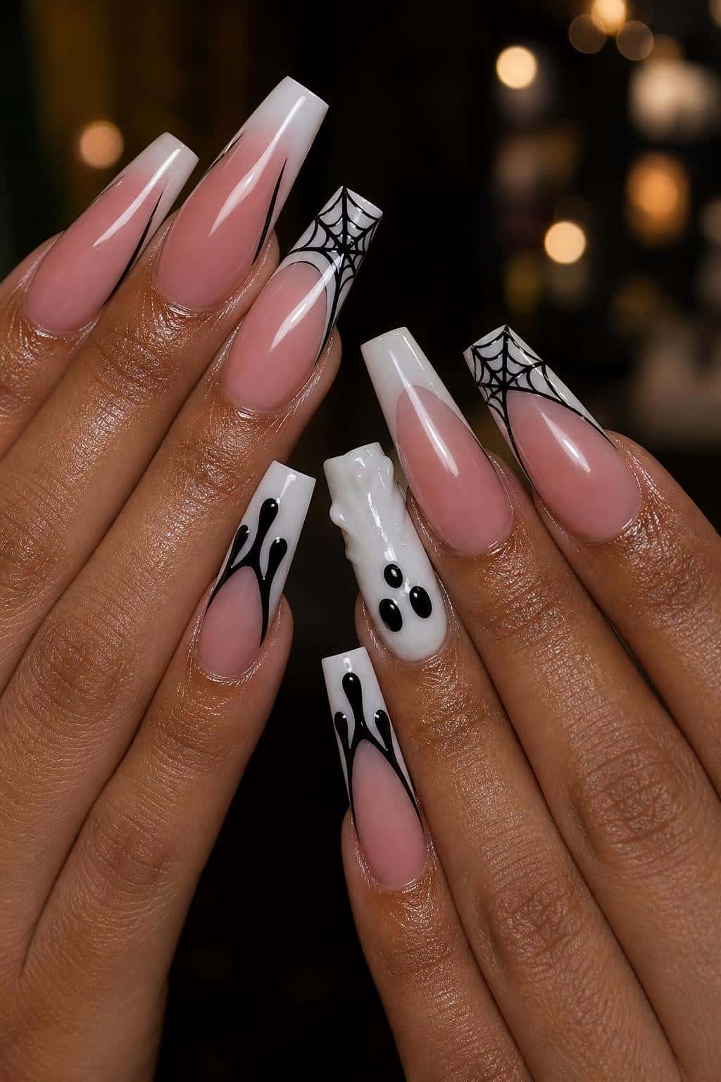 7 halloween nail ideas on manicured hands, tagged halloween nails, spookyseason, nail inspo.