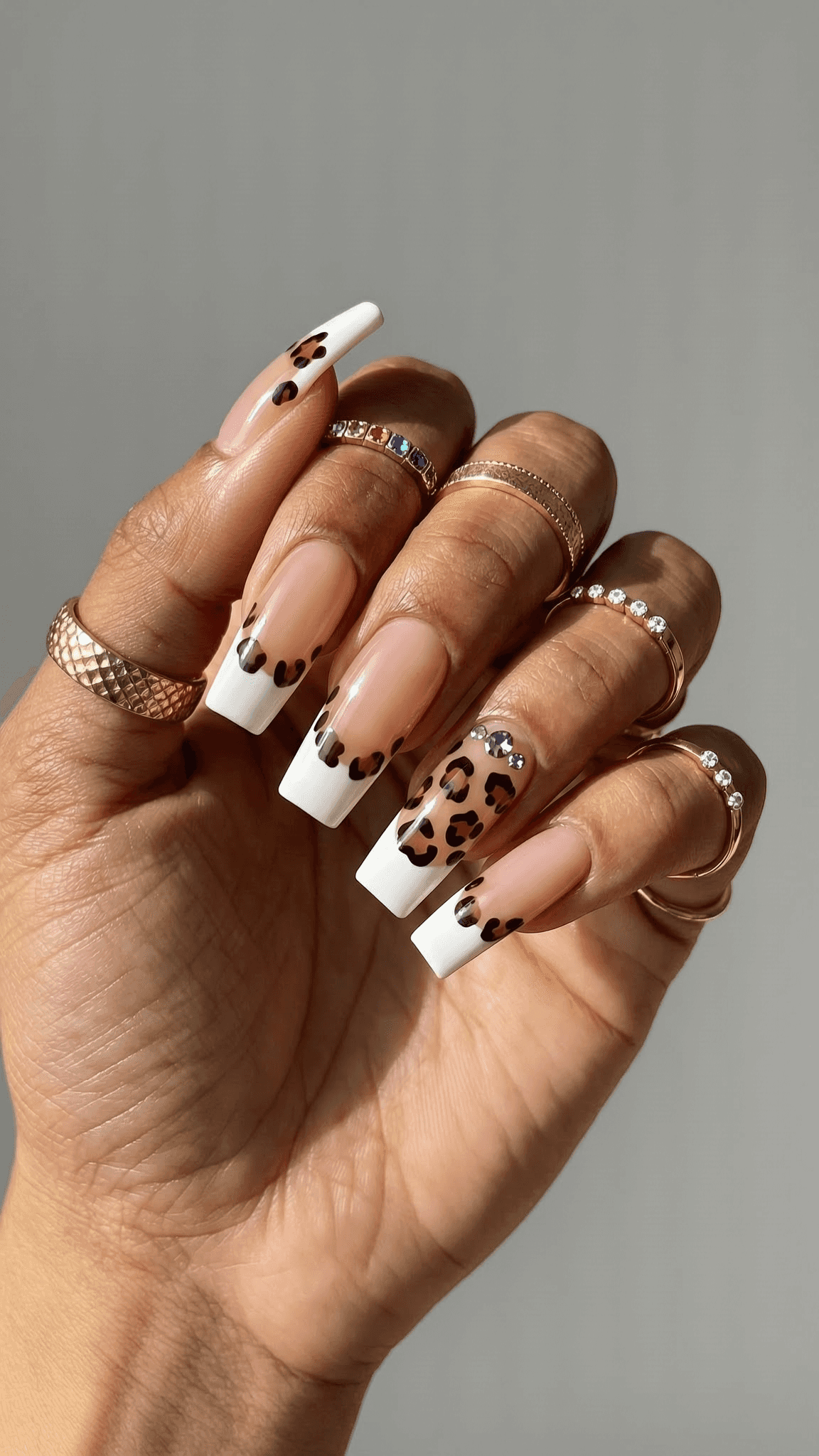 4 trendy nail ideas on manicured hands, tagged nail inspo, nail art, animalprintnails.