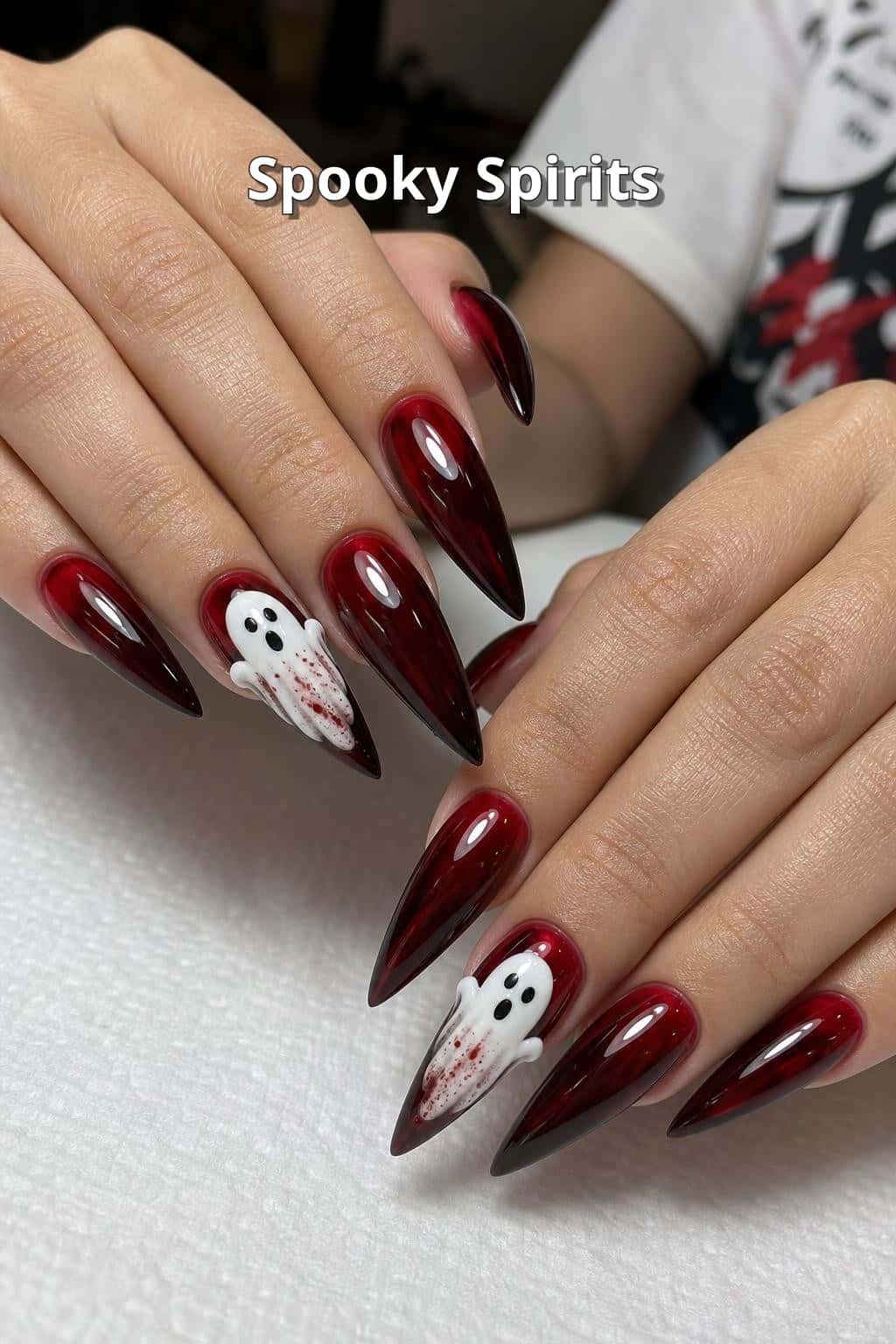 5 halloween nail ideas on manicured hands, including spooky spirits, vampire vixen, candy corn cuties, bloody good fun.