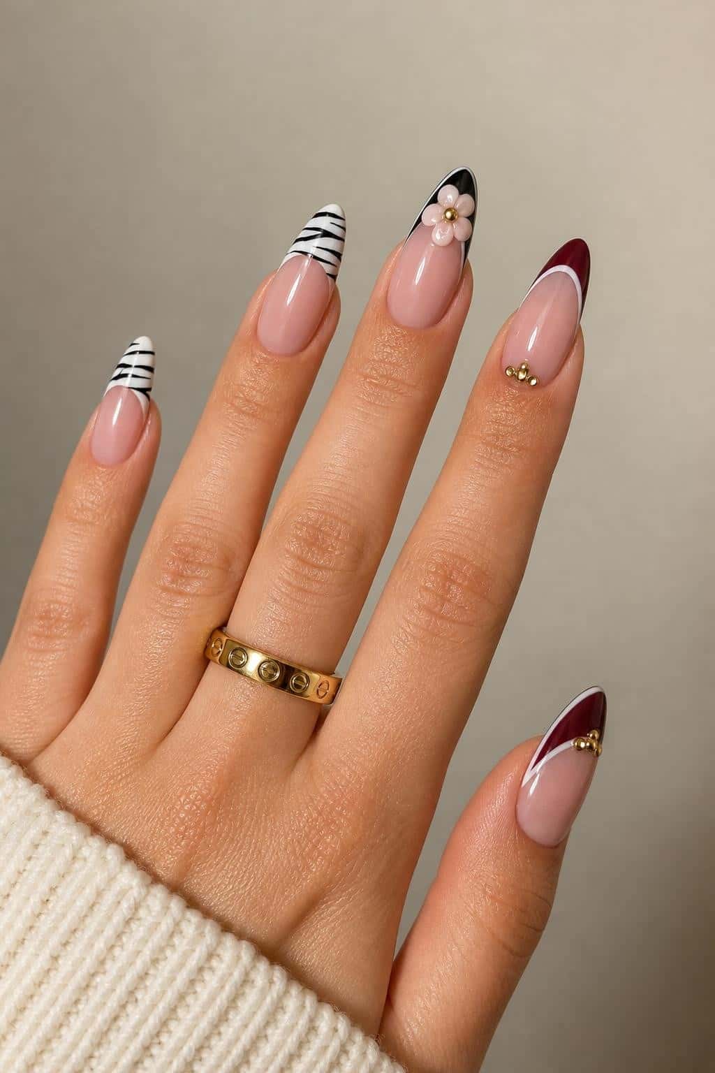 4 fall nail ideas on manicured hands, tagged autumn nail art, fall nails, nail trends.