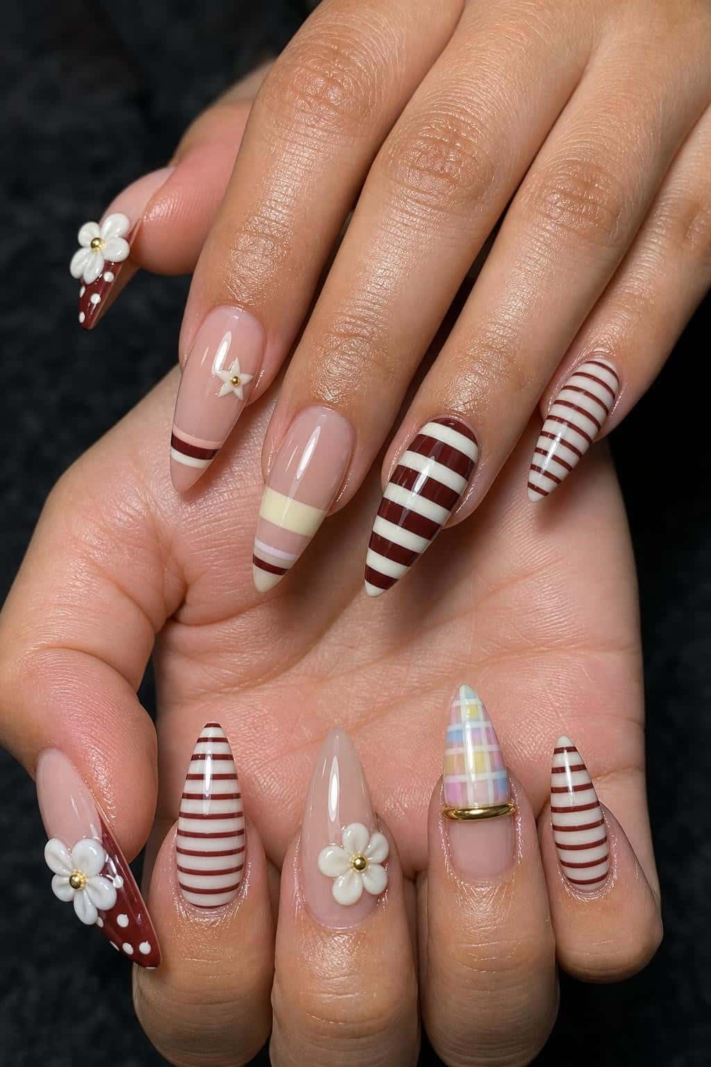4 fall nail ideas on manicured hands, tagged autumn nail art, fall nails, nail trends.