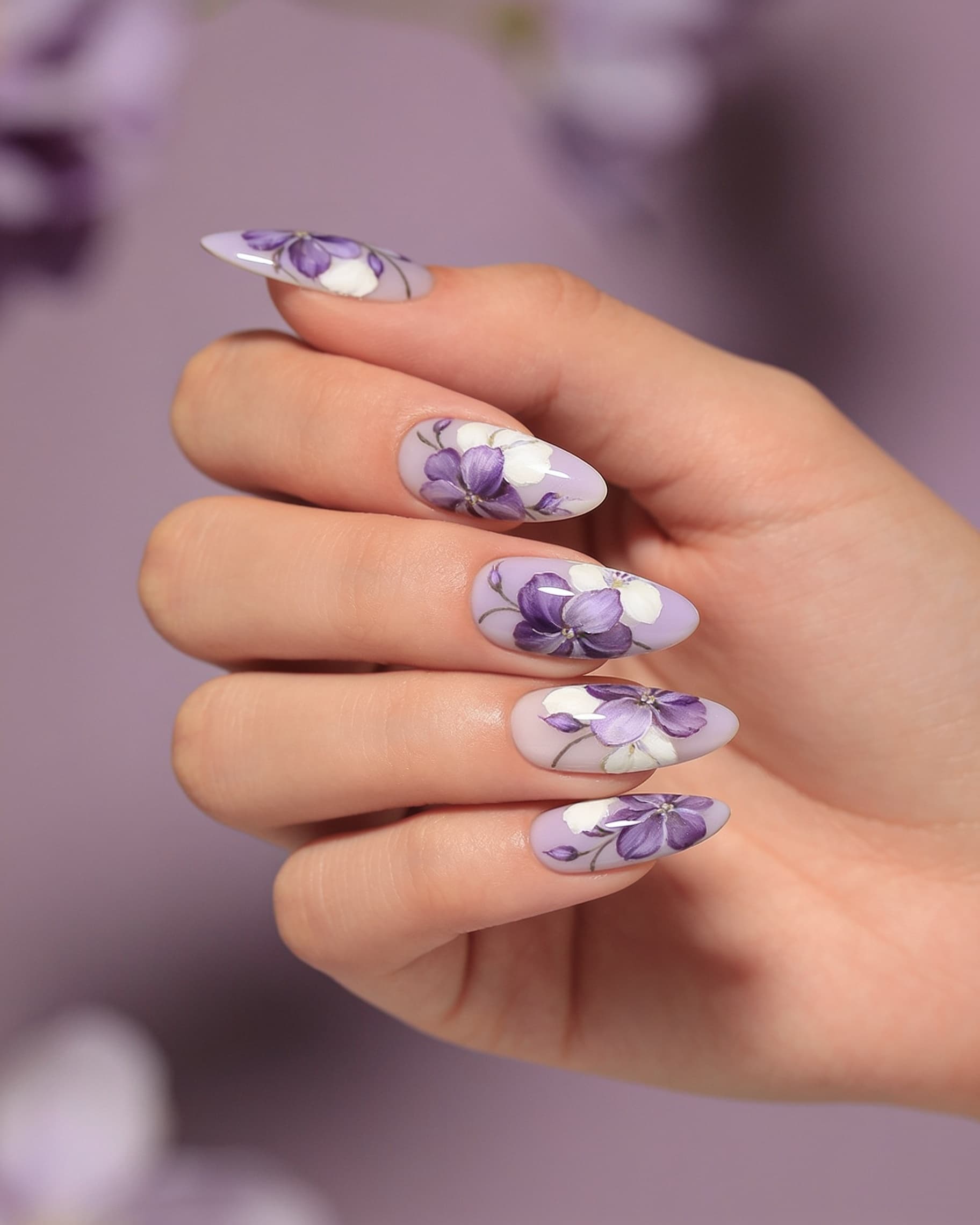 Floral nail art AI try-on preview: purple floral design on almond nails generated by NailMock