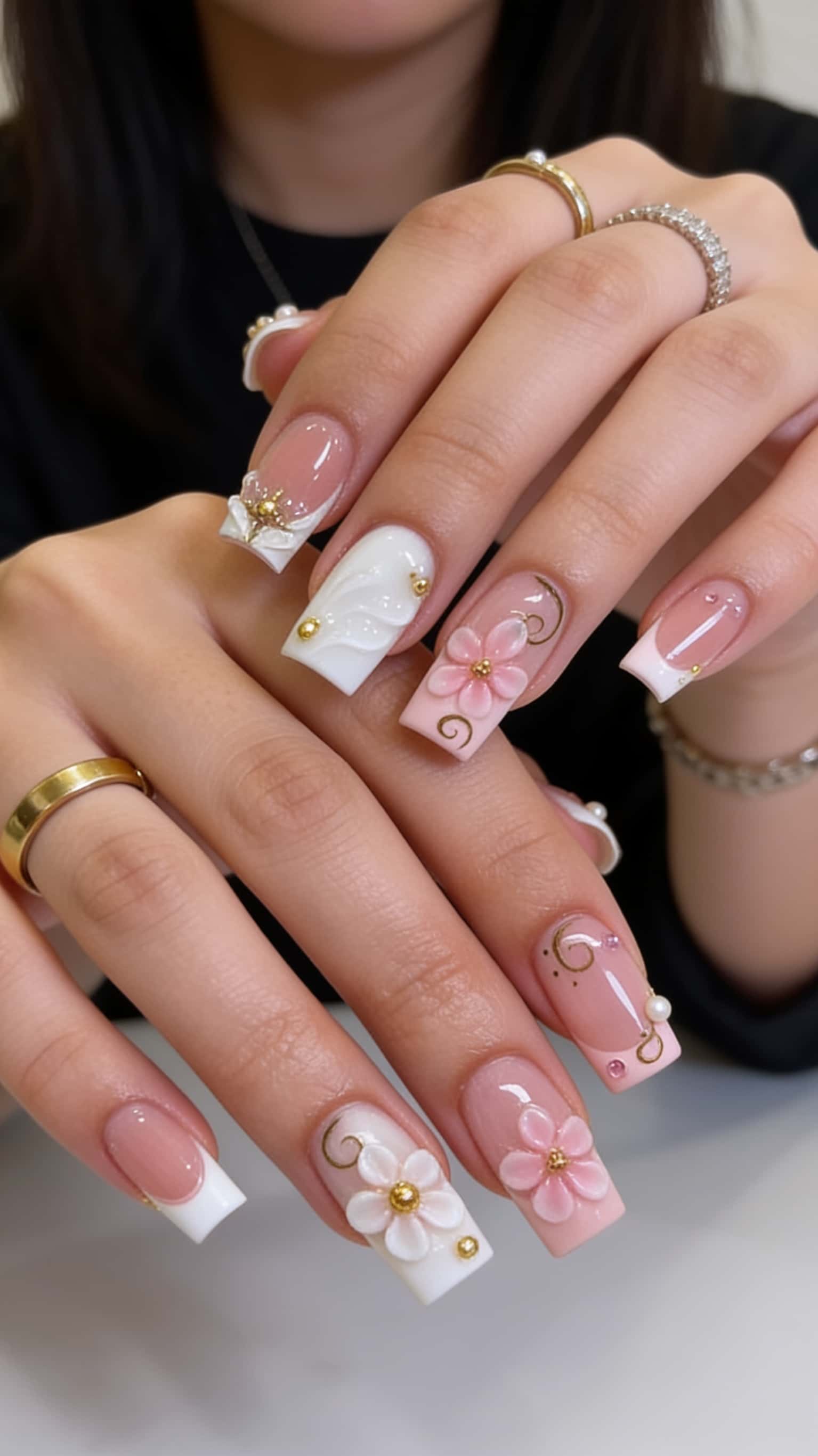 Long square nails with 3D floral French tips, gold accents, and glossy finish.