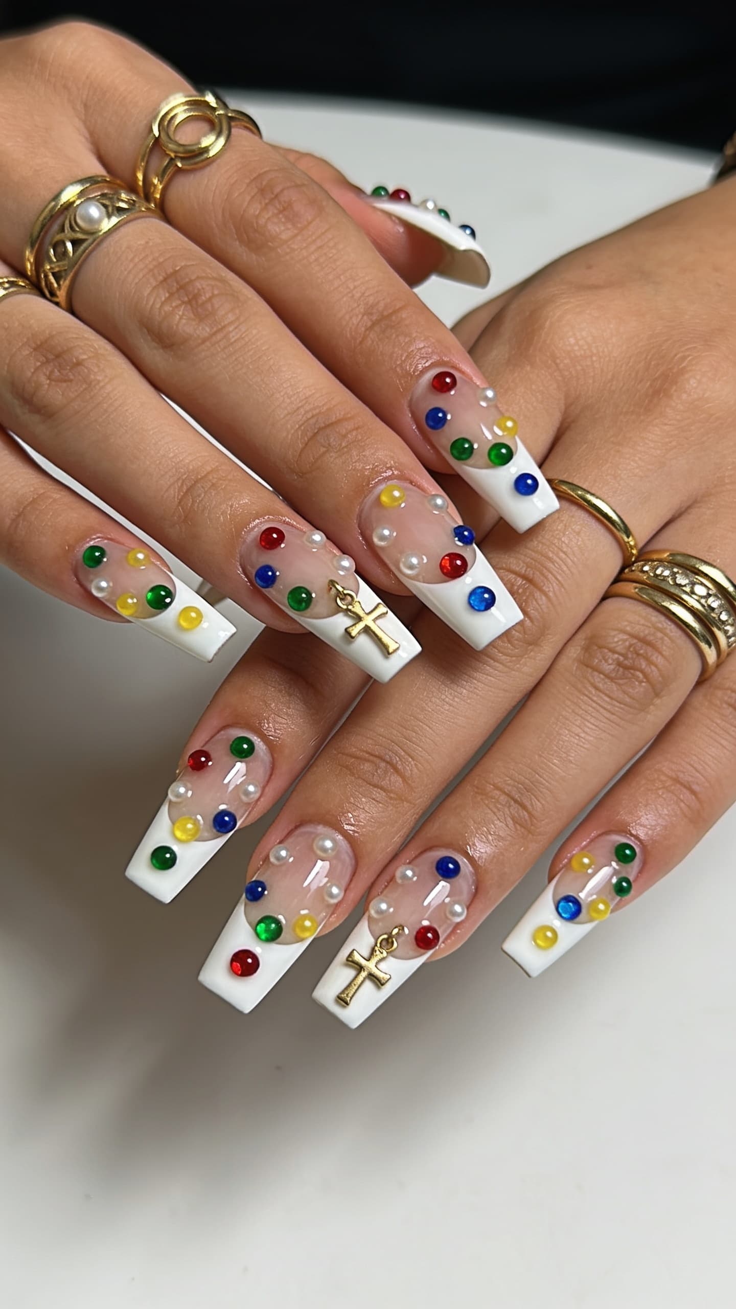 Colorful Gem French nail inspo with multi-color crystals along the tip line