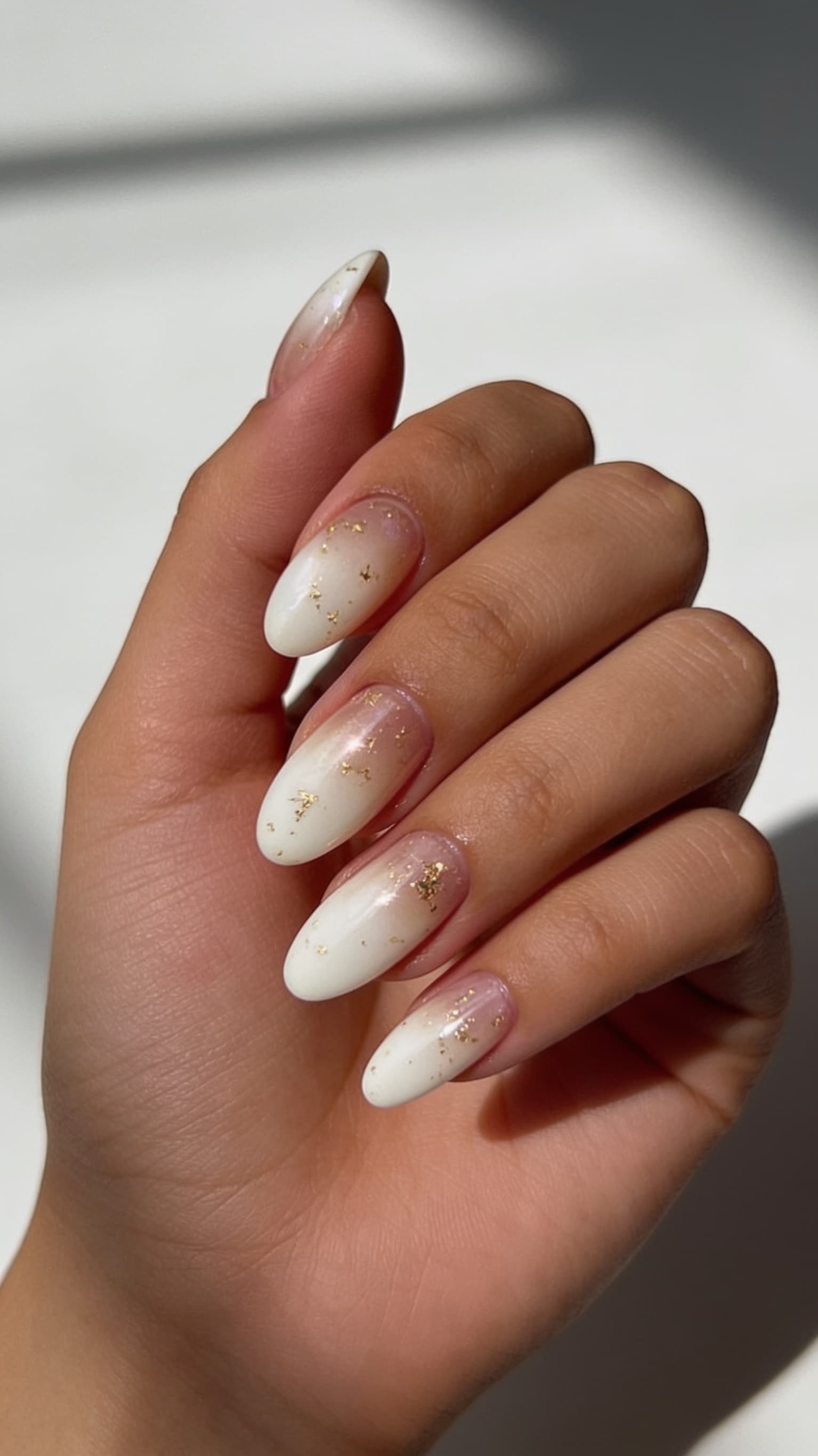 Gold Flake Ombre nail inspo with warm metallic shimmer fading toward the tips