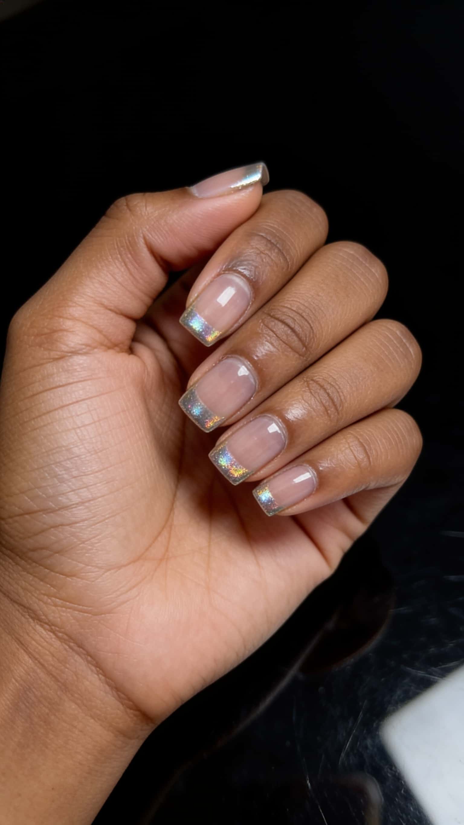 Long blue glitter stiletto nails with holographic shimmer and ombre tips.