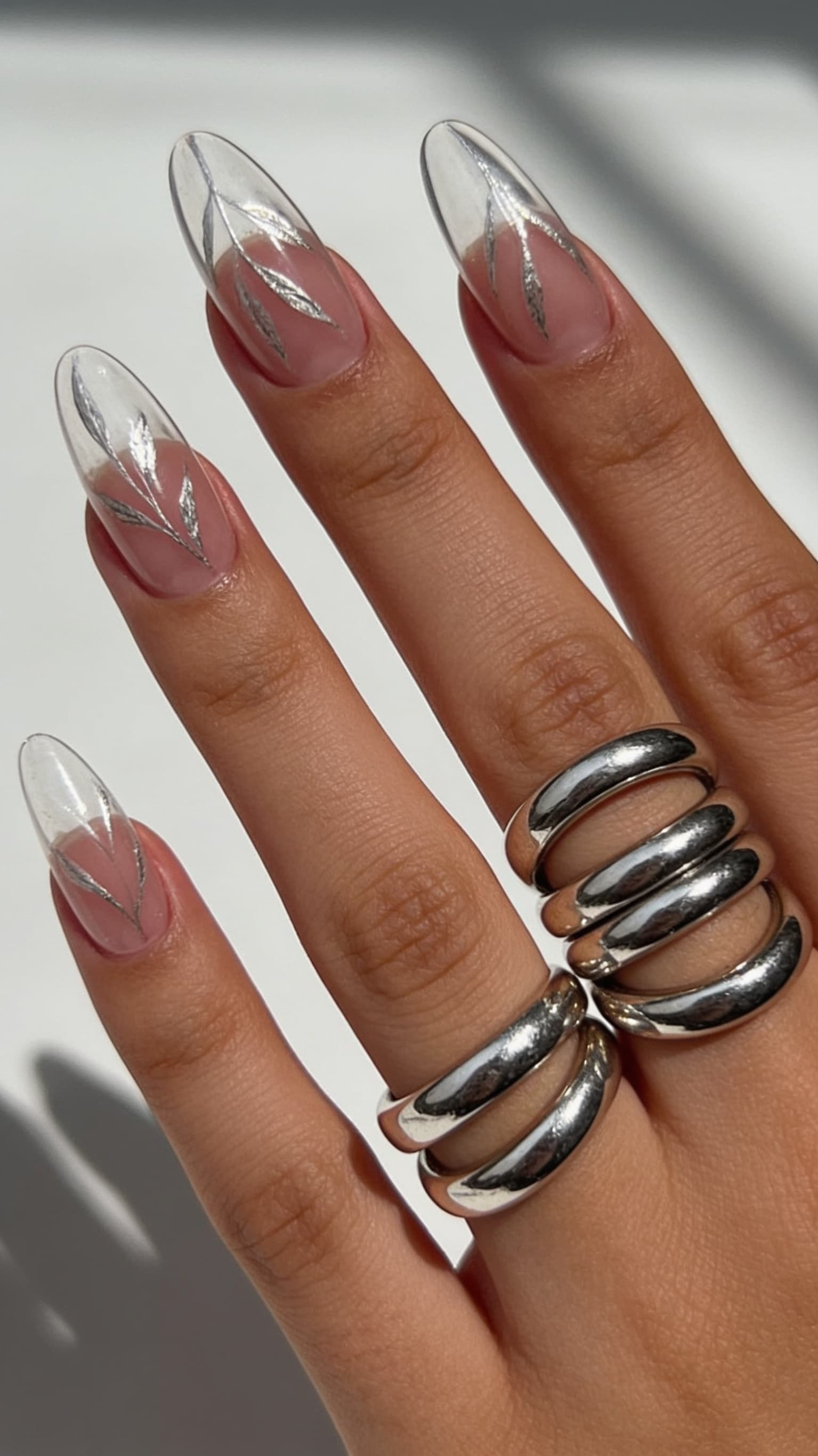 Silver Leaf Clear nail inspo with delicate metallic leaf on a sheer base